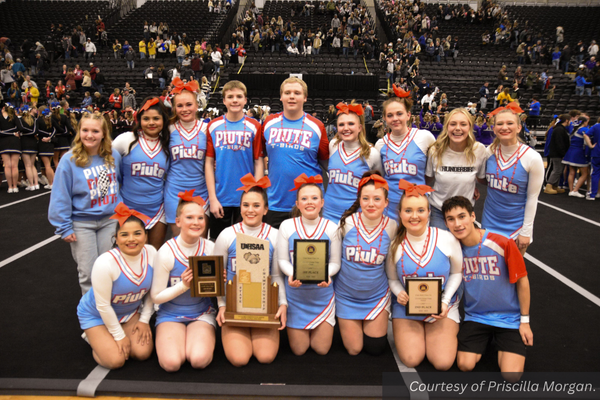 The Piute cheer team shows off their awards and trophies at state cheer. Courtesy of Priscilla Morgan.