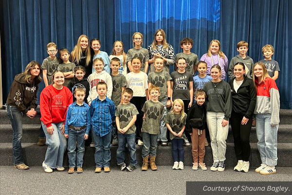 A group picture of six Piute FBLA members with the Oscarson Elementary School student body. Courtesy of Shauna Bagley.