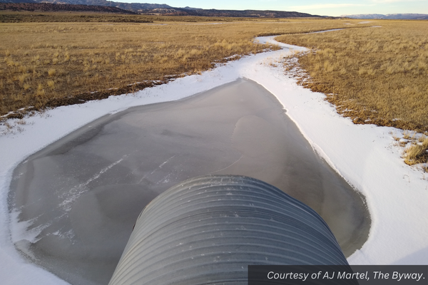 A culvert with Sevier River flood water on Johns Valley Landfill Road. Courtesy of AJ Martel, The Byway.