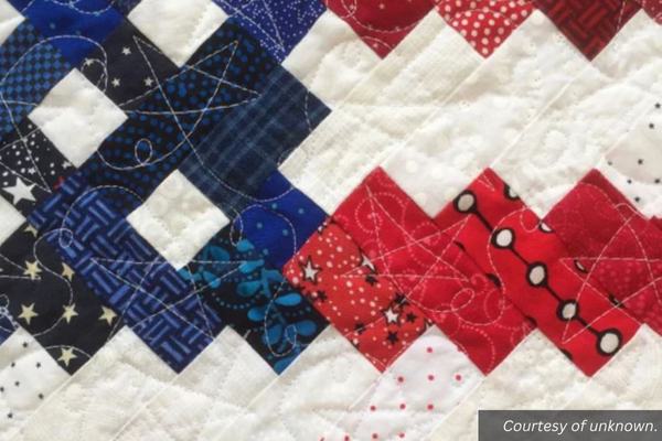 A square-based quilt pattern that looks like an American flag. Courtesy of unknown.