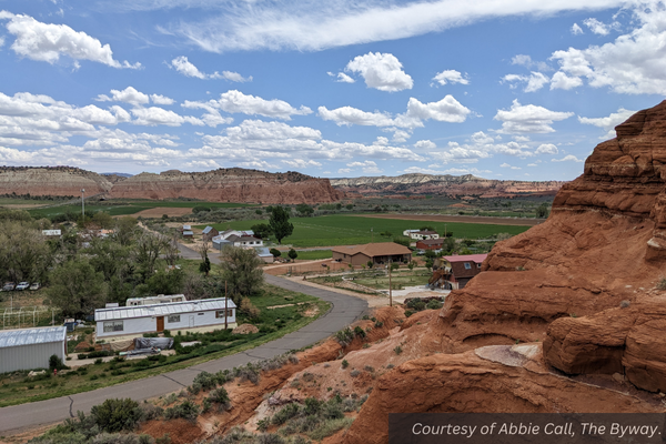 The red rock in Cannonville, with farm fields in the background.