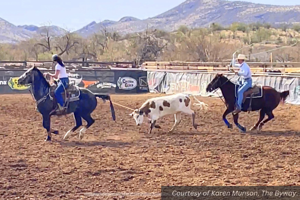 Melisa Chynoweth and her roping partner practicing with a calf in their arena in Escalante. Courtesy of Karen Munson, The Byway.